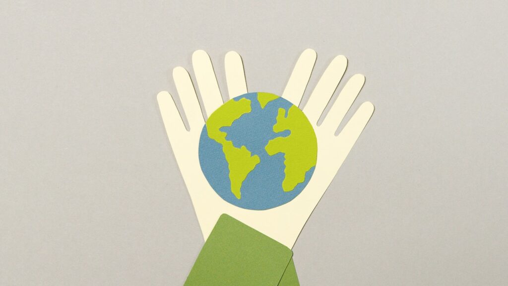 cartoon earth between two hands
