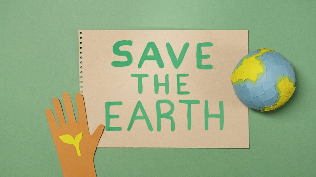 cartoon save the earth on a notebook